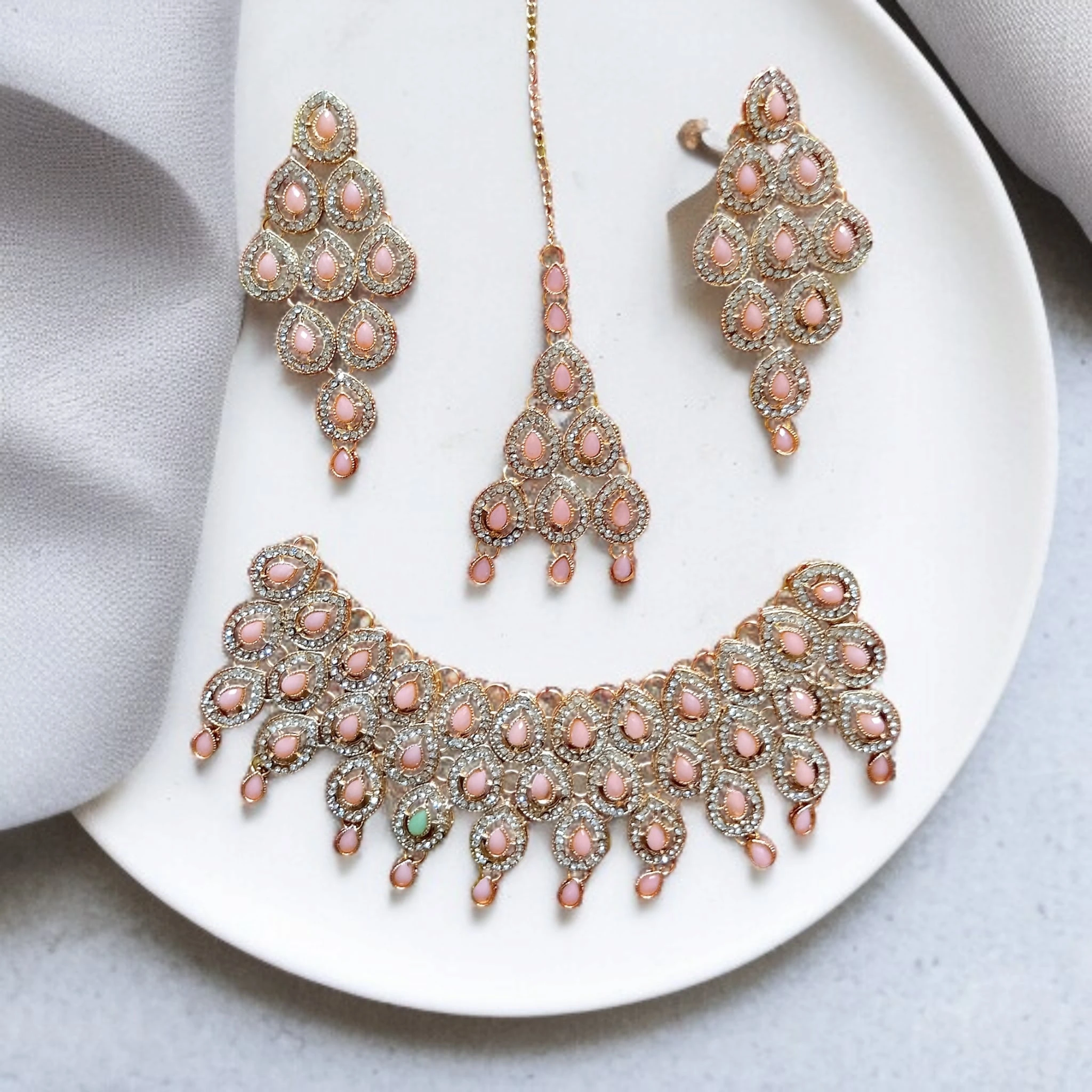 Buy Pink colour jewellery set with necklace , earrings and tikka at best price in pakistan